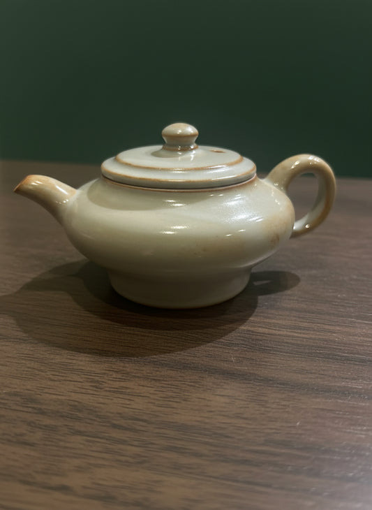 Yixing-style Desert Pearl teapot, handcrafted with warm beige clay.