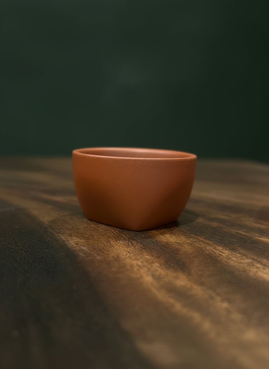 Handcrafted clay piala with natural earthy texture.