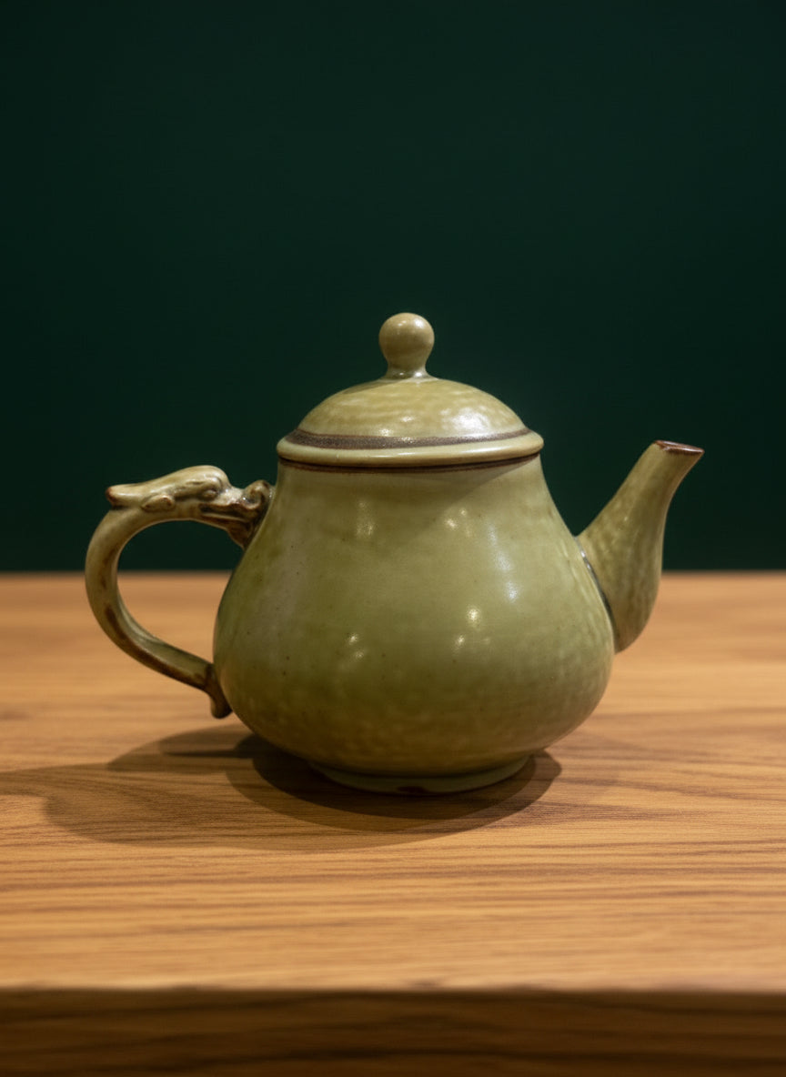 Yixing teapot “Green Dragon,” featuring traditional design and elegant green accents.