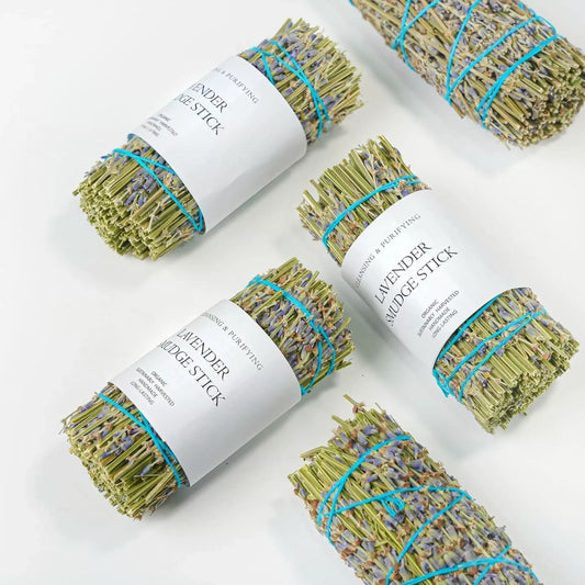 Lavender smudge sticks tied in bundles with labels for cleansing rituals