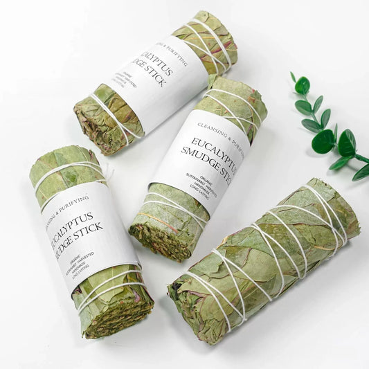 Eucalyptus smudge sticks tied in bundles with labels for cleansing rituals