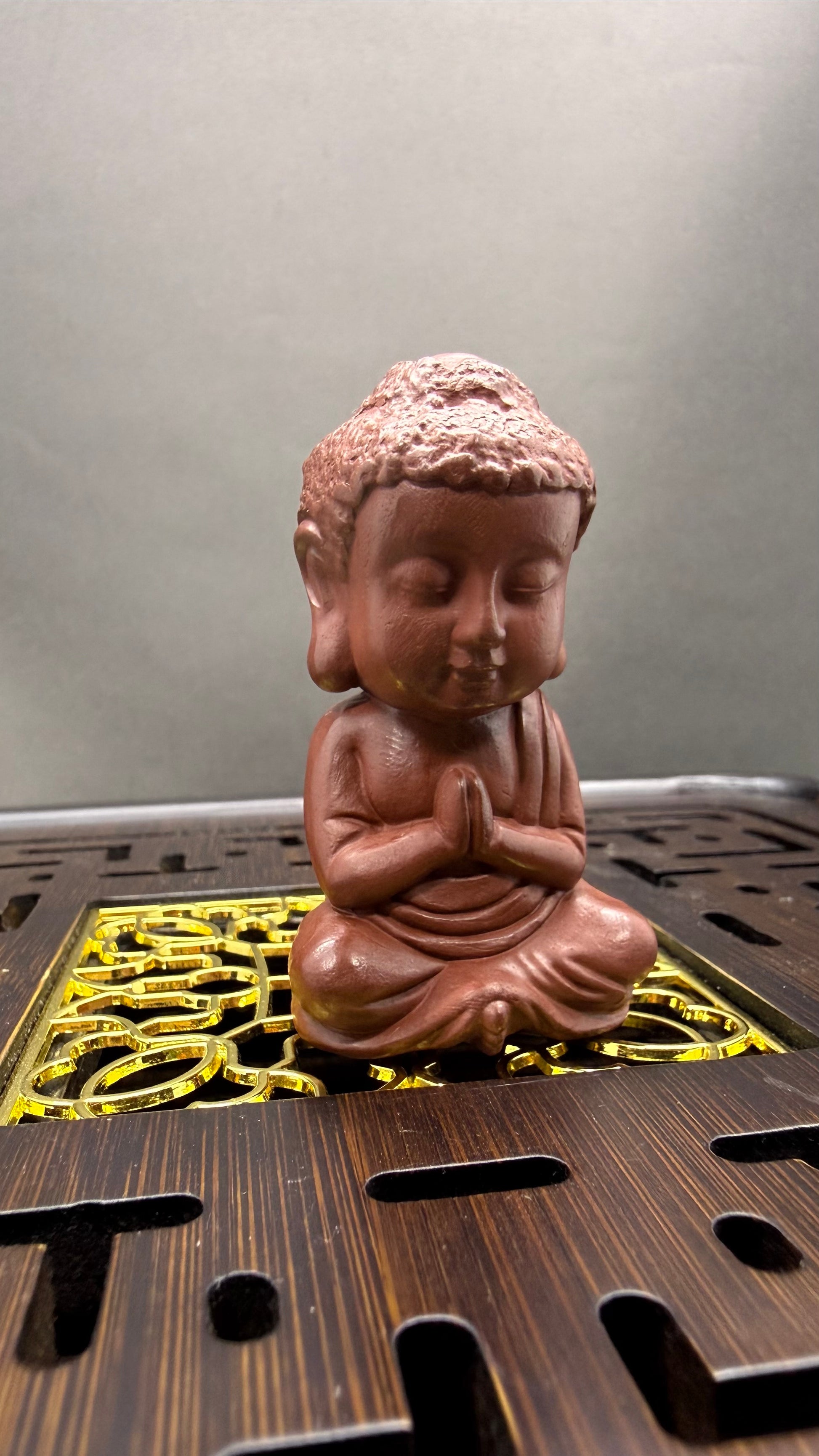 “Amber Monk ceramic tea accessory”