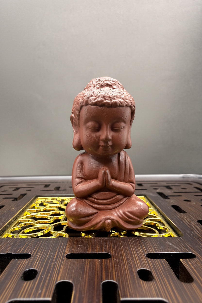 “Amber Monk ceramic tea accessory”