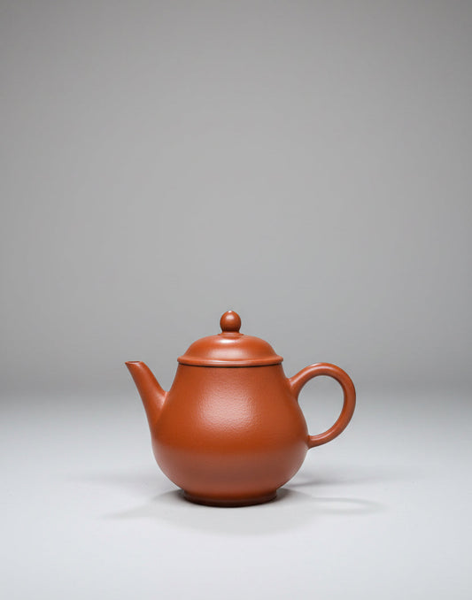 “Oval orange Yixing clay teapot”