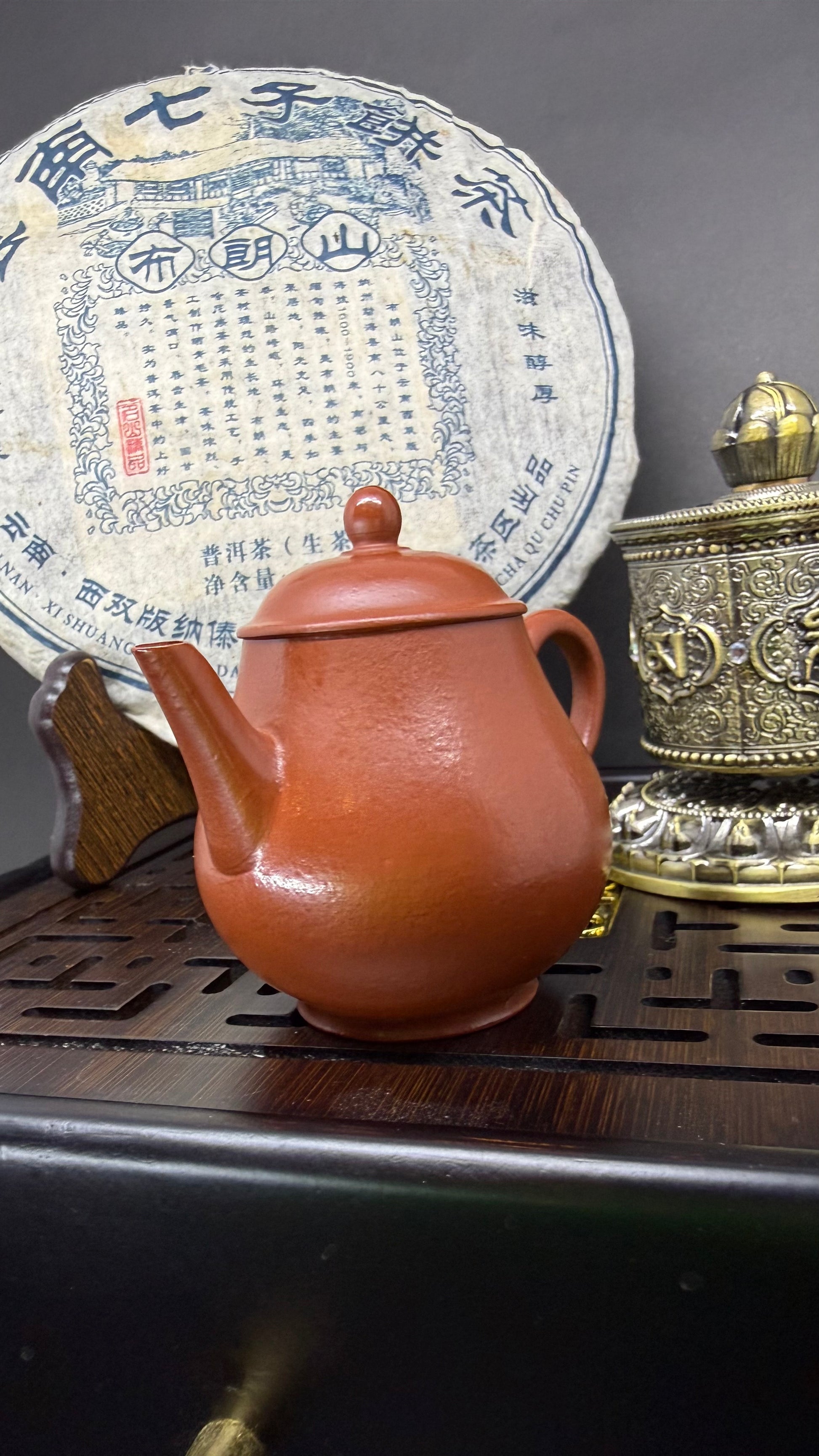 “Oval orange Yixing clay teapot”