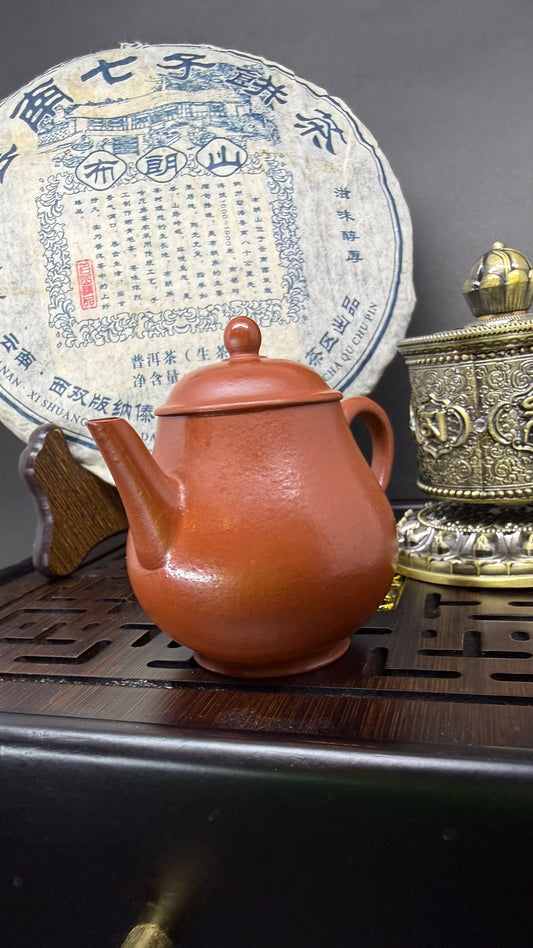 “Oval orange Yixing clay teapot”