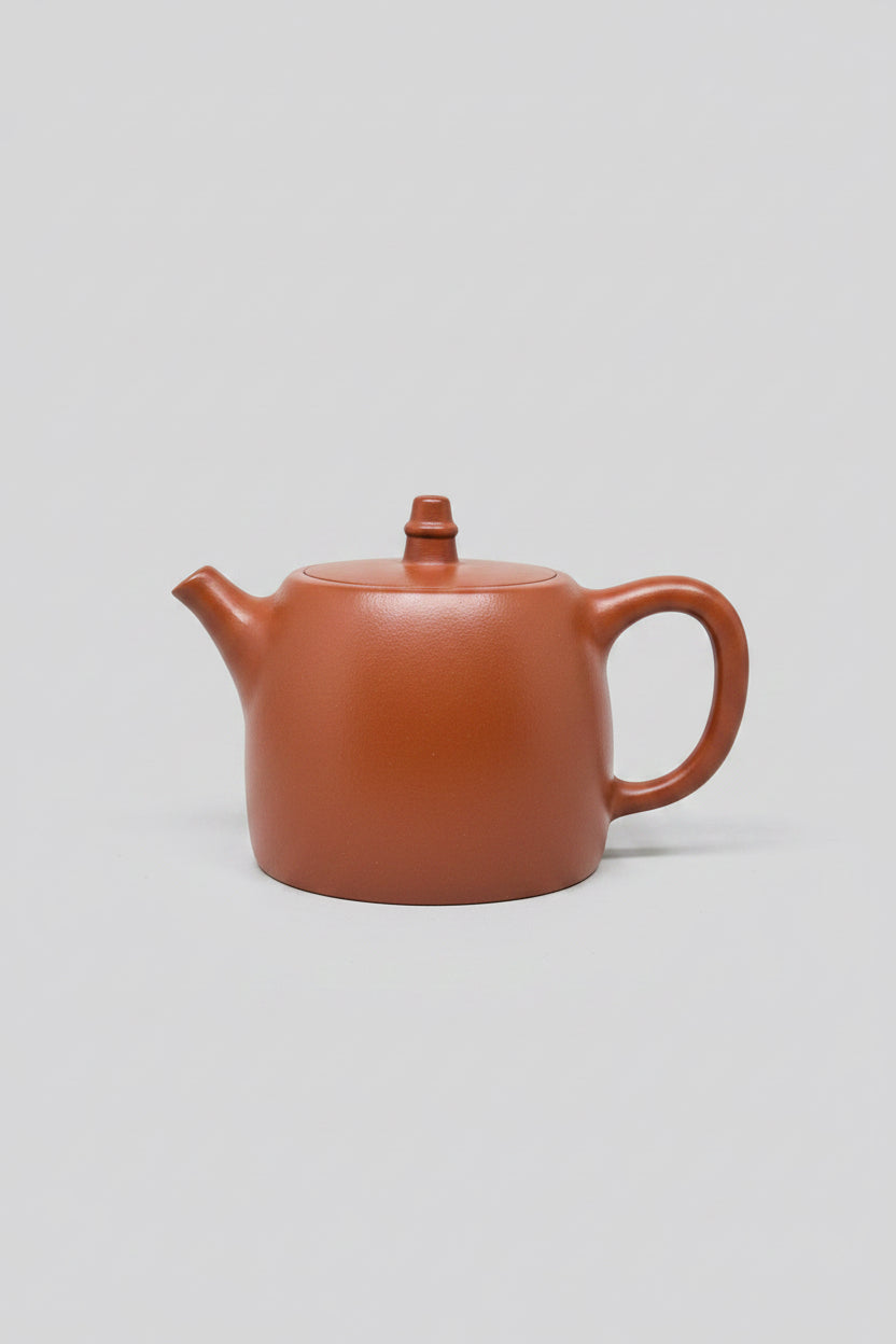 “Orange almost rectangular Yixing clay teapot”