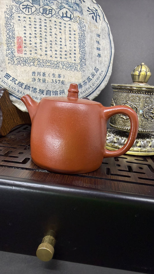 “Orange almost rectangular Yixing clay teapot”