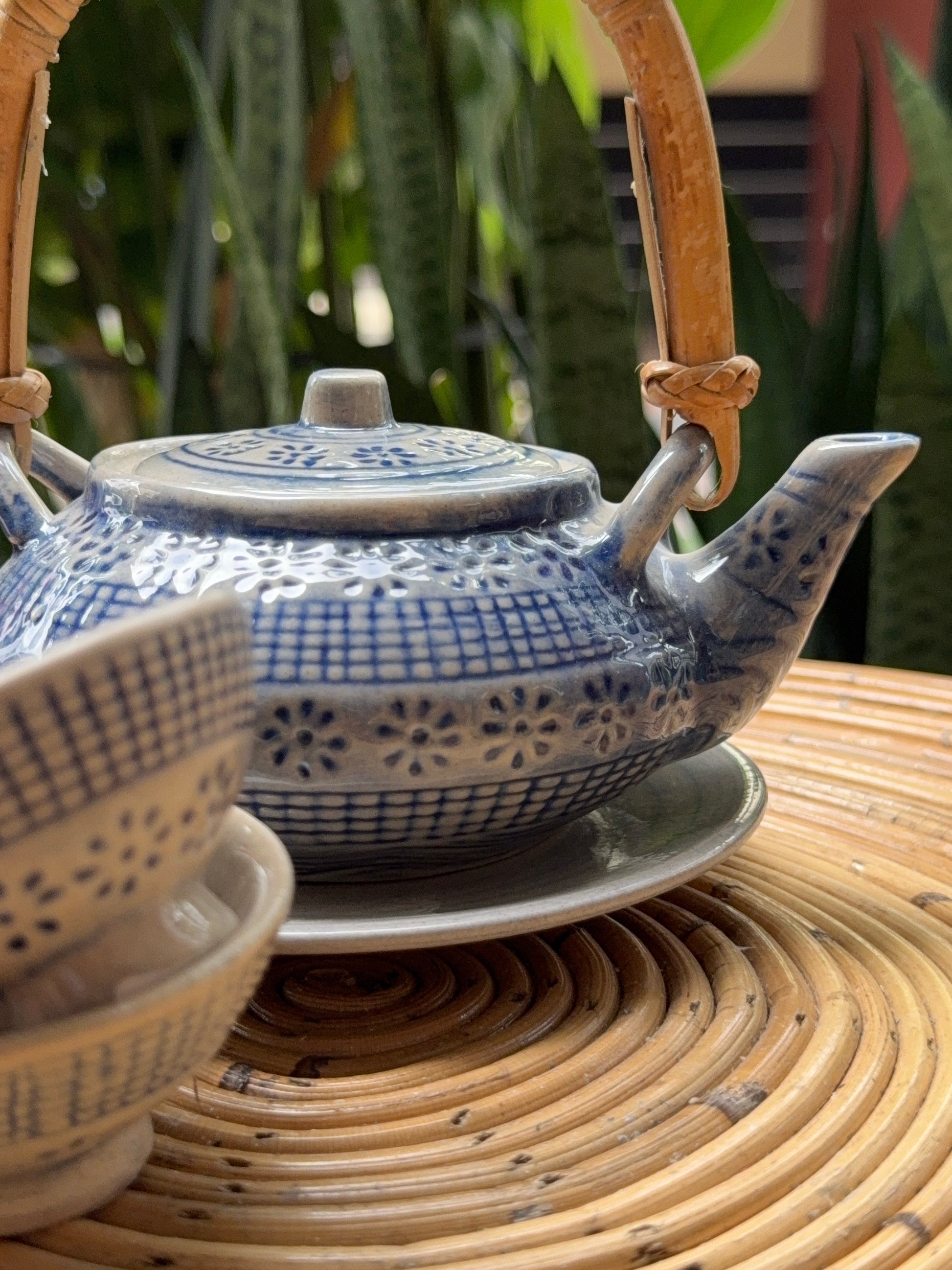 “Blue ceramic tea set with teapot and two cups”